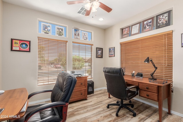 home office featuring light wood-type flooring and ceiling fan