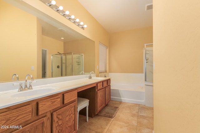 bathroom with plus walk in shower, tile patterned floors, and vanity