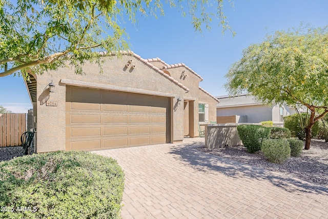 4084 E Caitlin Dr, San Tan Valley, AZ 85140 - view of front of house featuring stucco siding, fence, and a garage