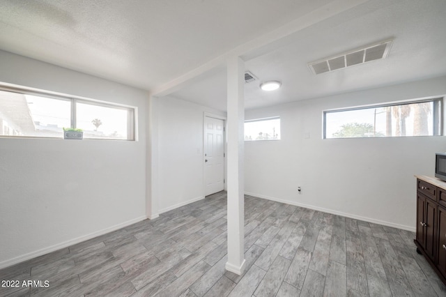 basement featuring light wood-type flooring