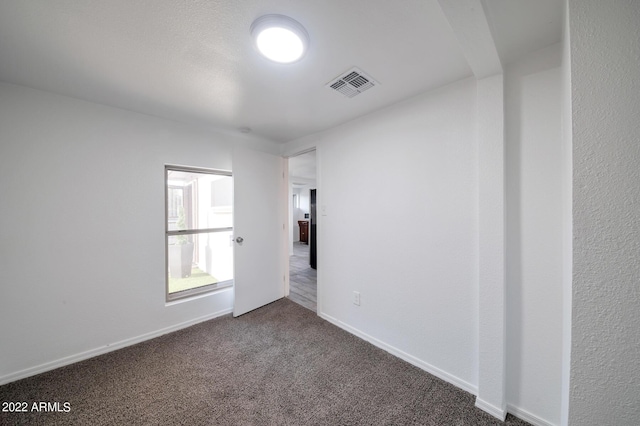 empty room featuring carpet floors