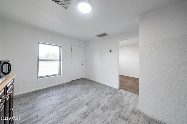 unfurnished room featuring light wood-type flooring