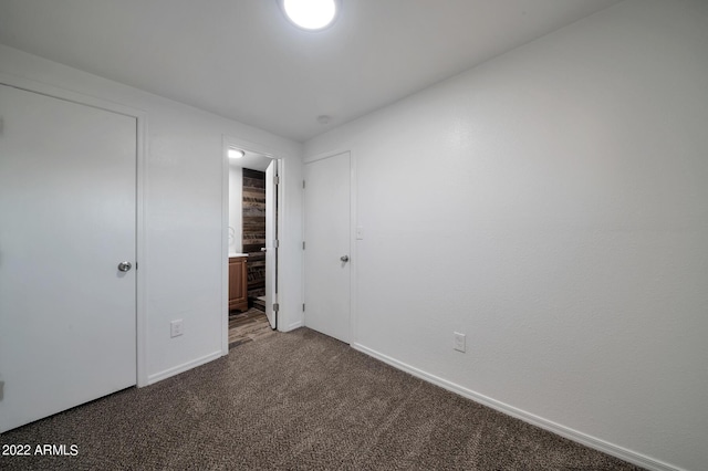 unfurnished bedroom featuring carpet