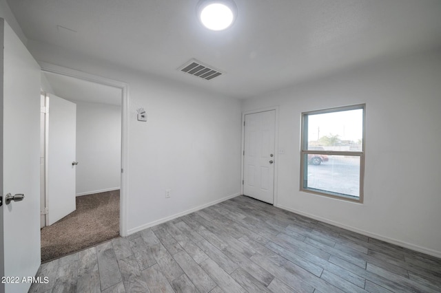 empty room with light wood-type flooring