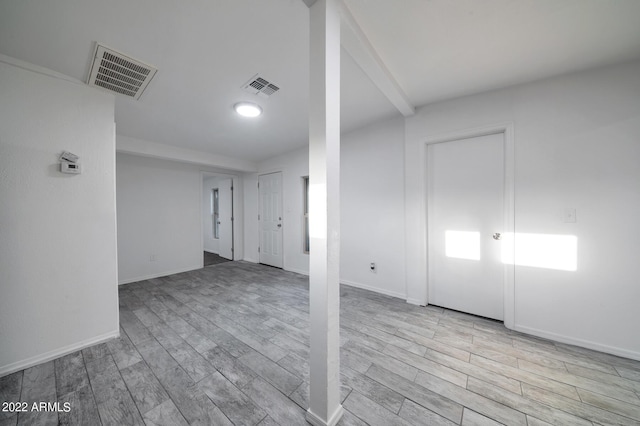 spare room with light hardwood / wood-style floors