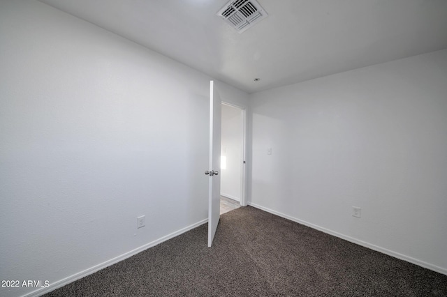 unfurnished room featuring carpet flooring