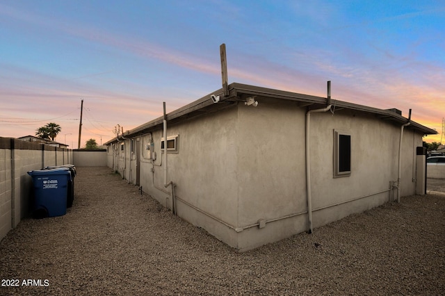 view of property exterior at dusk