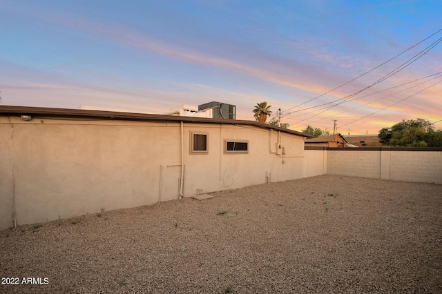 view of property exterior at dusk