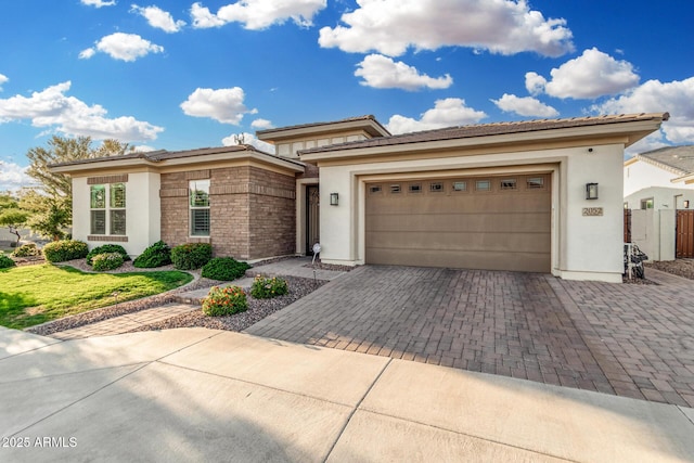 2052 E Scorpio Pl, Chandler, AZ 85249 - prairie-style house with stucco siding, decorative driveway, and an attached garage