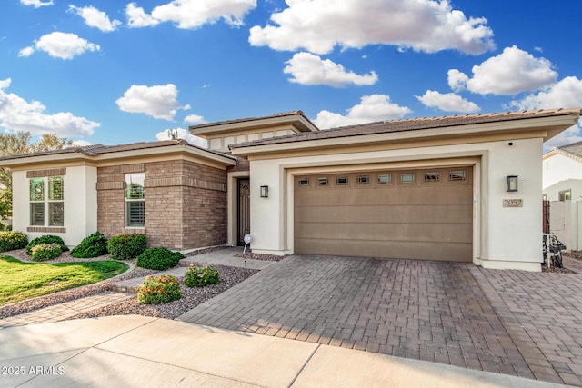 2052 E Scorpio Pl, Chandler, AZ 85249 - prairie-style home with stucco siding, decorative driveway, and an attached garage