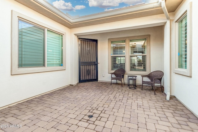 2052 E Scorpio Pl, Chandler, AZ 85249 - view of exterior entry with stucco siding and covered porch