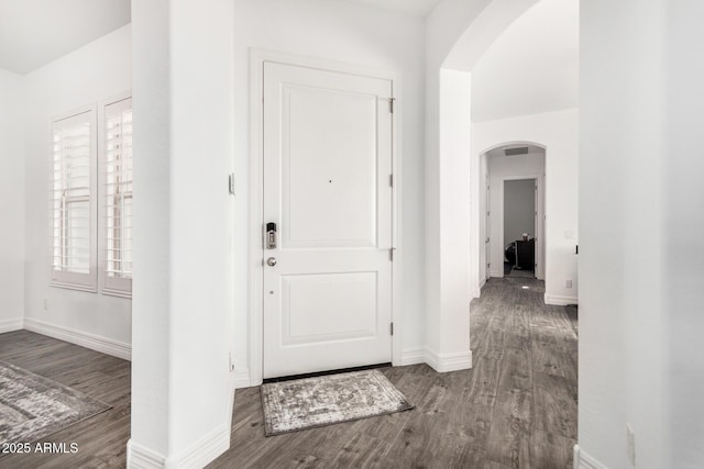 2052 E Scorpio Pl, Chandler, AZ 85249 - foyer entrance with arched walkways, wood finished floors, and baseboards