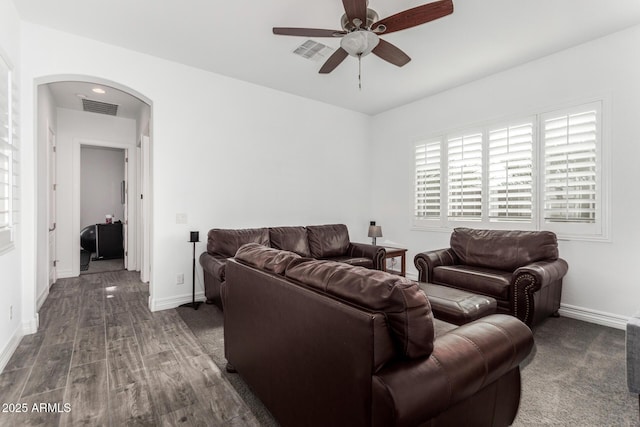 2052 E Scorpio Pl, Chandler, AZ 85249 - living room with arched walkways, ceiling fan, wood finished floors, and baseboards