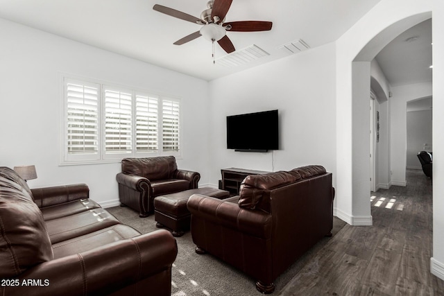 2052 E Scorpio Pl, Chandler, AZ 85249 - living area featuring arched walkways, ceiling fan, baseboards, and wood finished floors