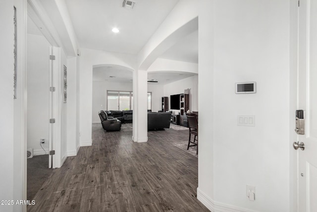 2052 E Scorpio Pl, Chandler, AZ 85249 - entrance foyer with arched walkways, dark wood finished floors, baseboards, and recessed lighting