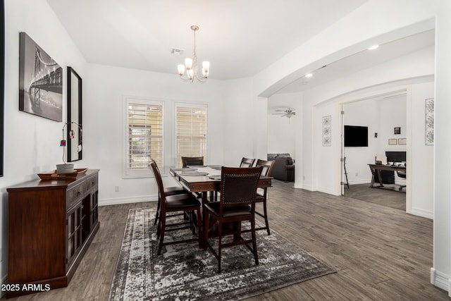2052 E Scorpio Pl, Chandler, AZ 85249 - dining space with a chandelier, arched walkways, dark wood-type flooring, and an office area