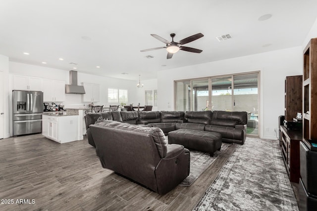 2052 E Scorpio Pl, Chandler, AZ 85249 - living room with ceiling fan, dark wood-type flooring, recessed lighting, and a chandelier