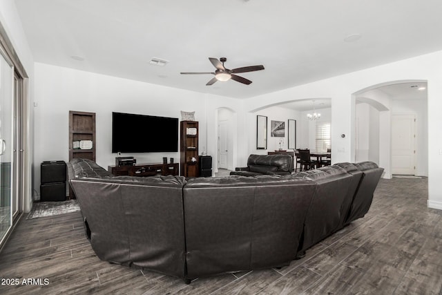 2052 E Scorpio Pl, Chandler, AZ 85249 - living room featuring arched walkways, dark wood-type flooring, and ceiling fan