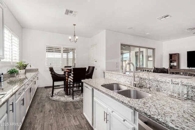 2052 E Scorpio Pl, Chandler, AZ 85249 - kitchen featuring a sink, dark wood finished floors, a chandelier, dishwasher, and white cabinetry
