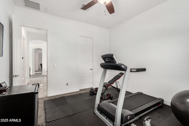 2052 E Scorpio Pl, Chandler, AZ 85249 - exercise room featuring arched walkways, a ceiling fan, and baseboards