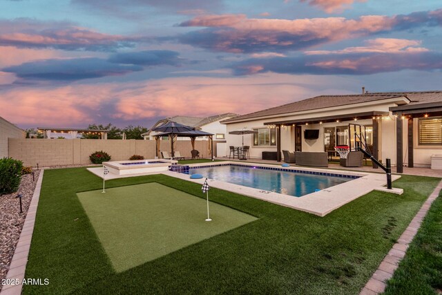 2052 E Scorpio Pl, Chandler, AZ 85249 - view of swimming pool featuring a putting area, outdoor lounge area, a gazebo, a patio area, and a fenced backyard