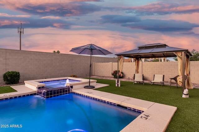 2052 E Scorpio Pl, Chandler, AZ 85249 - pool at dusk featuring a gazebo and a pool with connected hot tub