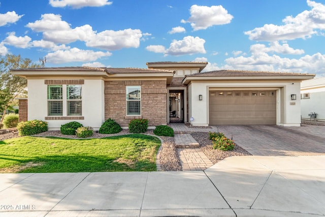 2052 E Scorpio Pl, Chandler, AZ 85249 - prairie-style home featuring stucco siding, driveway, an attached garage, and a front yard