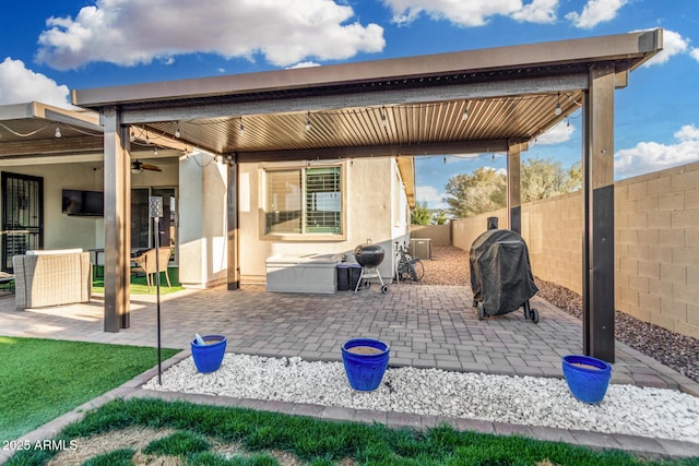 2052 E Scorpio Pl, Chandler, AZ 85249 - fenced backyard featuring a grill, a patio area, and a ceiling fan