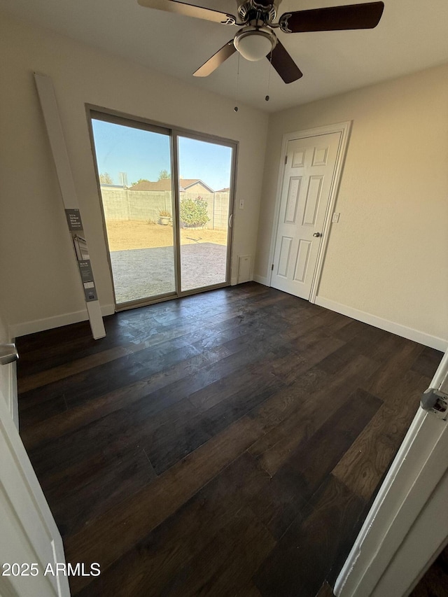 1841 N Wilbur Cir, Mesa, AZ 85201 - spare room featuring ceiling fan, baseboards, and dark wood finished floors