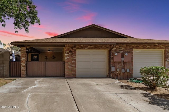 1807 E Jamaica Ave, Mesa, AZ 85204 - view of front of property with driveway, brick siding, a garage, a gate, and roof with shingles