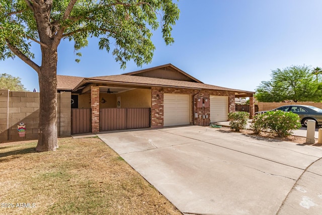 1807 E Jamaica Ave, Mesa, AZ 85204 - single story home with concrete driveway, an attached garage, brick siding, roof with shingles, and a gate