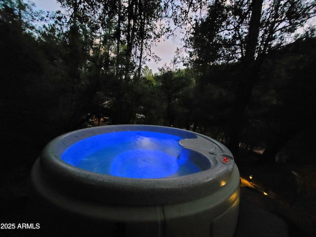 view of pool at dusk