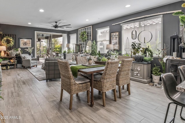 dining room with a ceiling fan, recessed lighting, and light wood-style floors