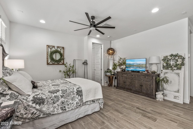 bedroom featuring recessed lighting, visible vents, wood finished floors, and ceiling fan