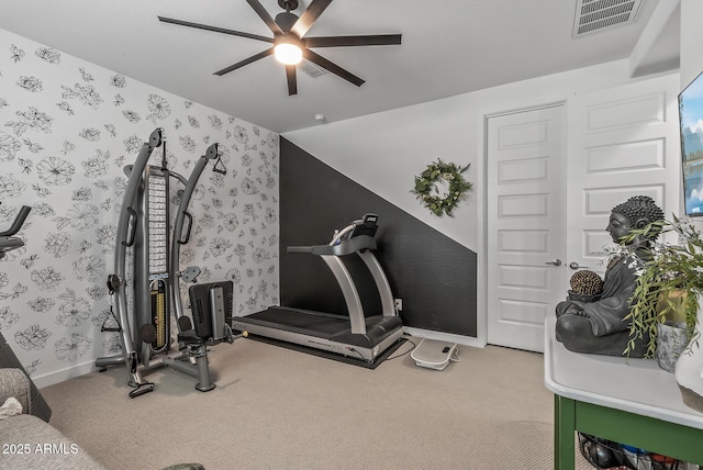 exercise room featuring visible vents, carpet flooring, wallpapered walls, baseboards, and ceiling fan