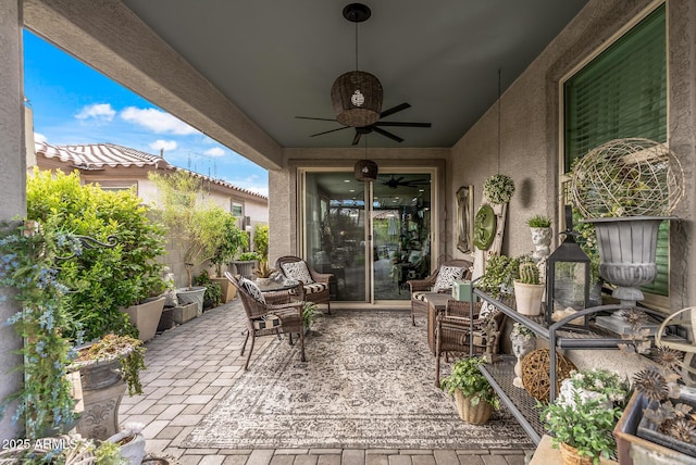 view of patio / terrace featuring a ceiling fan and fence