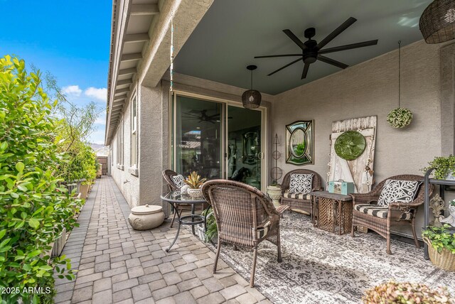 view of patio featuring outdoor lounge area and ceiling fan