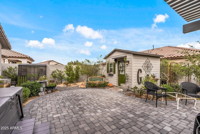 view of patio / terrace featuring a fenced backyard and an outdoor structure