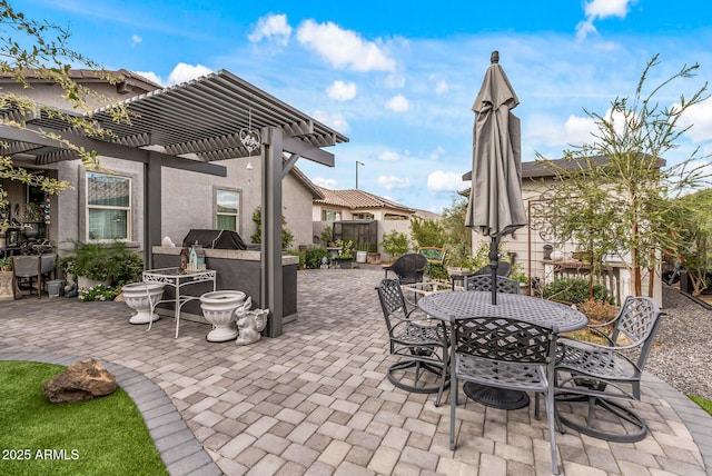 view of patio with an outdoor kitchen, outdoor dining space, and a pergola