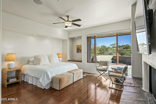 bedroom with dark wood-type flooring and ceiling fan