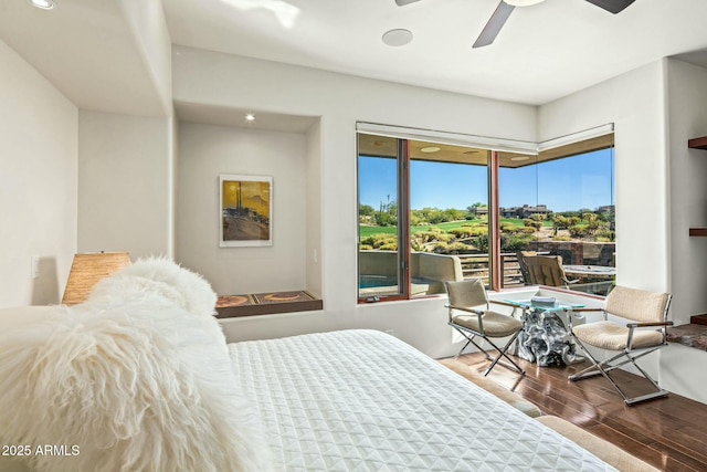 bedroom featuring hardwood / wood-style floors and ceiling fan