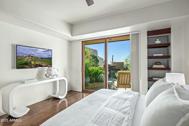 bedroom with access to exterior, dark hardwood / wood-style floors, and ceiling fan