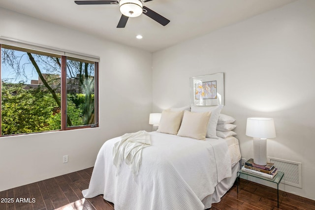 bedroom featuring dark hardwood / wood-style floors and ceiling fan