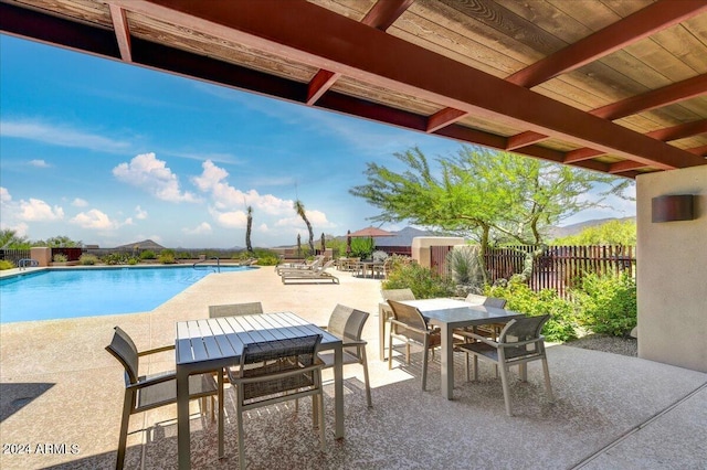 view of patio with a fenced in pool