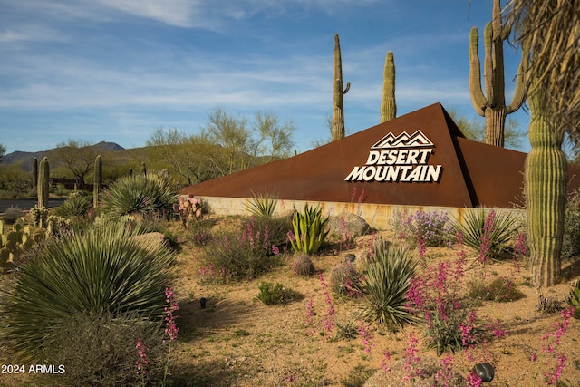 community sign with a mountain view