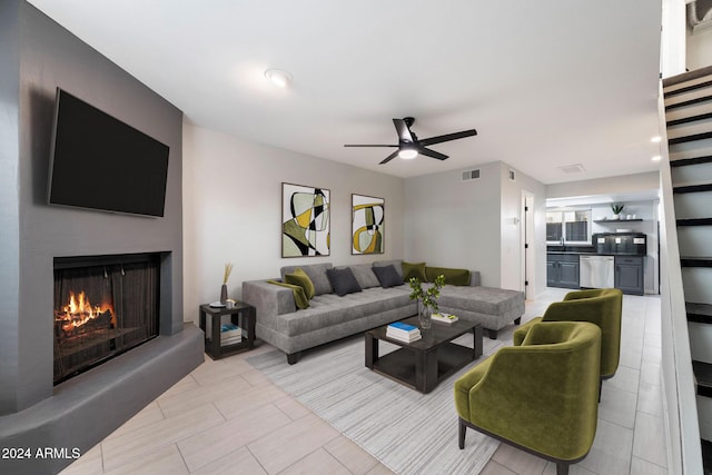 living room featuring ceiling fan