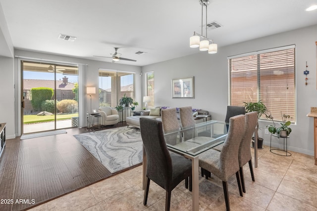 dining room featuring light tile patterned floors and visible vents