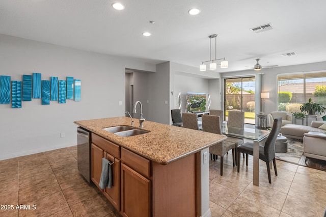 kitchen with visible vents, a sink, open floor plan, brown cabinetry, and dishwasher