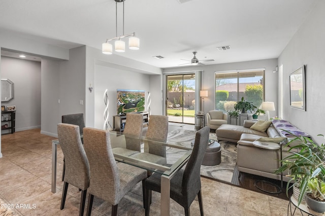 dining area featuring visible vents, baseboards, and a ceiling fan