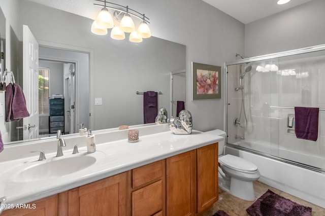 full bath with vanity, enclosed tub / shower combo, toilet, tile patterned floors, and a notable chandelier